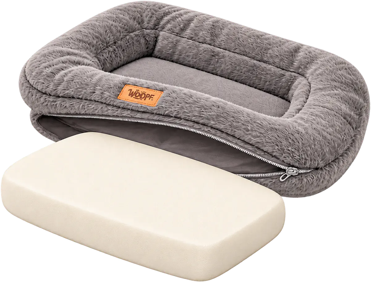 Illustrated empty grey WOOPF™ Furry Range Rectangle Bed with its cover unzipped and the cream foam insert pulled out in front of it