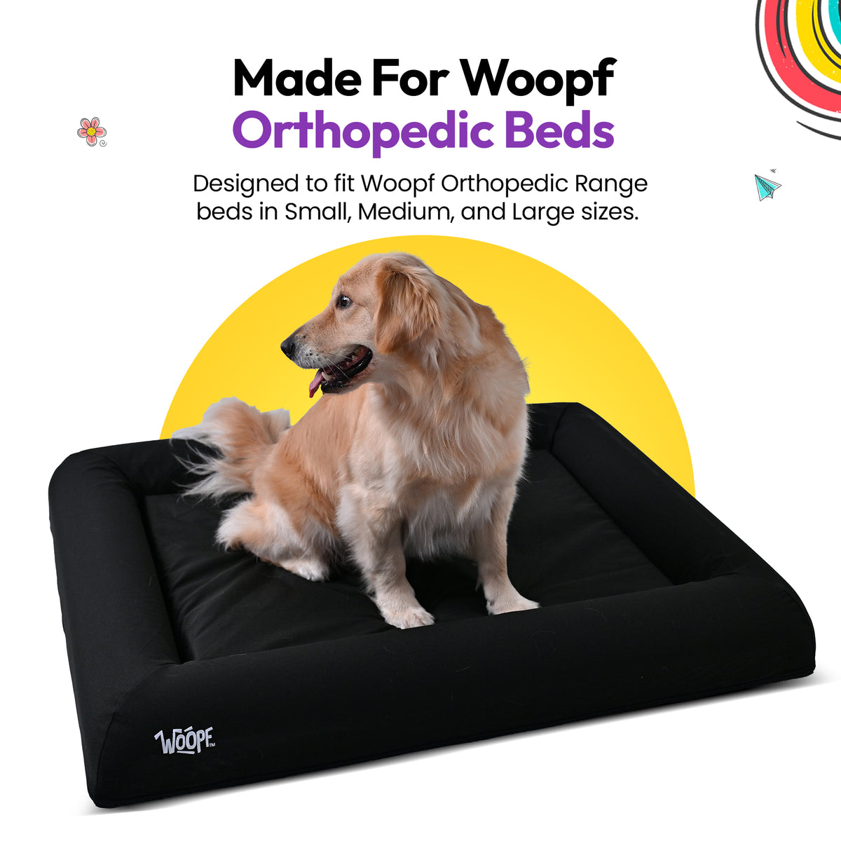 Black | SNÜZ Bed Cover (Dig-Proof & Waterproof): Golden retriever sitting on the Black cover, headed Made For Woopf Orthopedic Beds