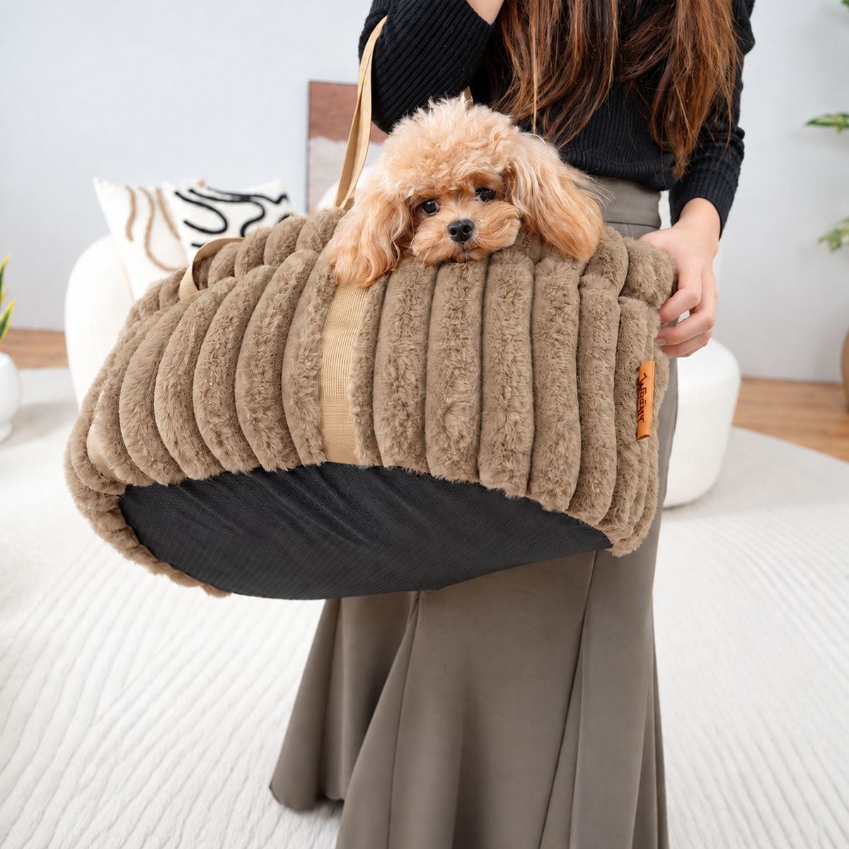 Brown | Corduroy Calming Dog Carrier: Woman carrying a toy poodle in the Brown carrier on her shoulder