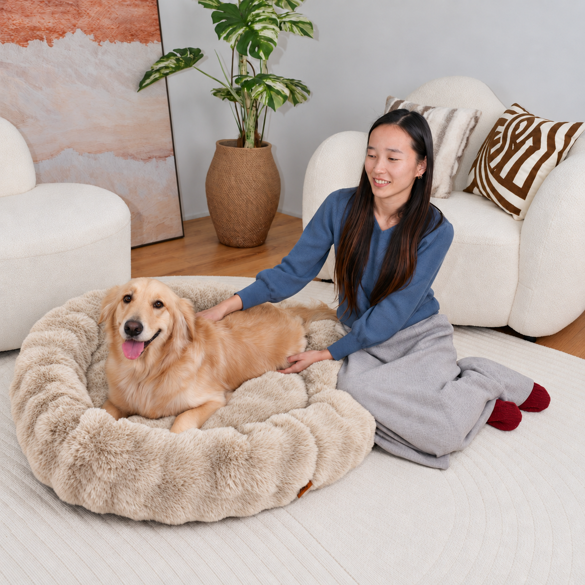 Cream | Furry Curves Round Bed: A woman with a golden retriever lying in the Cream round bed
