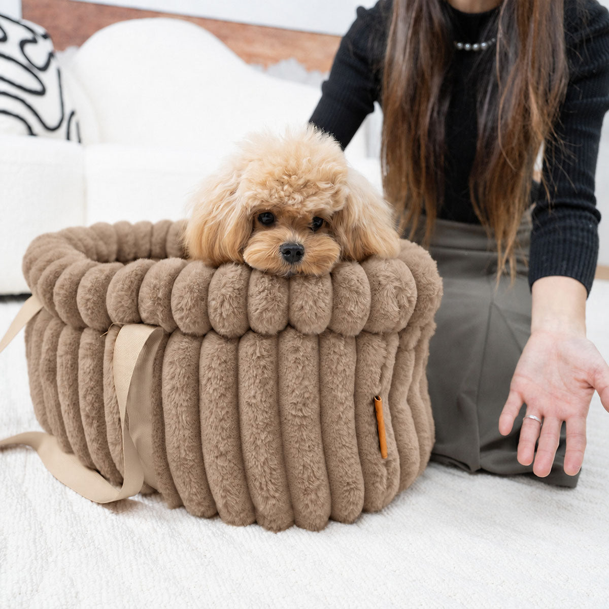 Brown | Corduroy Calming Dog Carrier: Toy poodle resting its chin on the rim of the Brown carrier, with a hand beside it