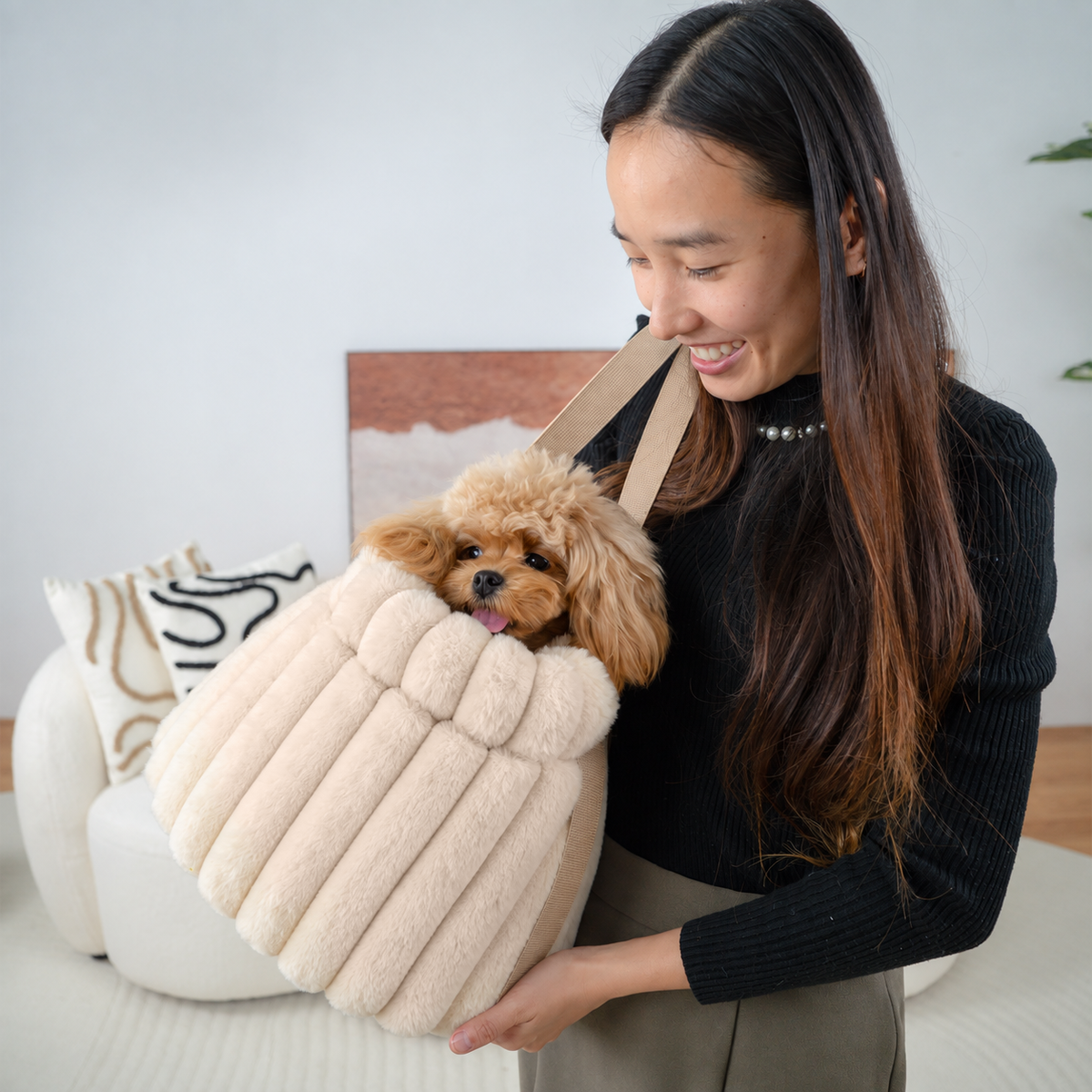 Pale pink | Corduroy Calming Dog Carrier: Woman holding a toy poodle in the Pale pink carrier