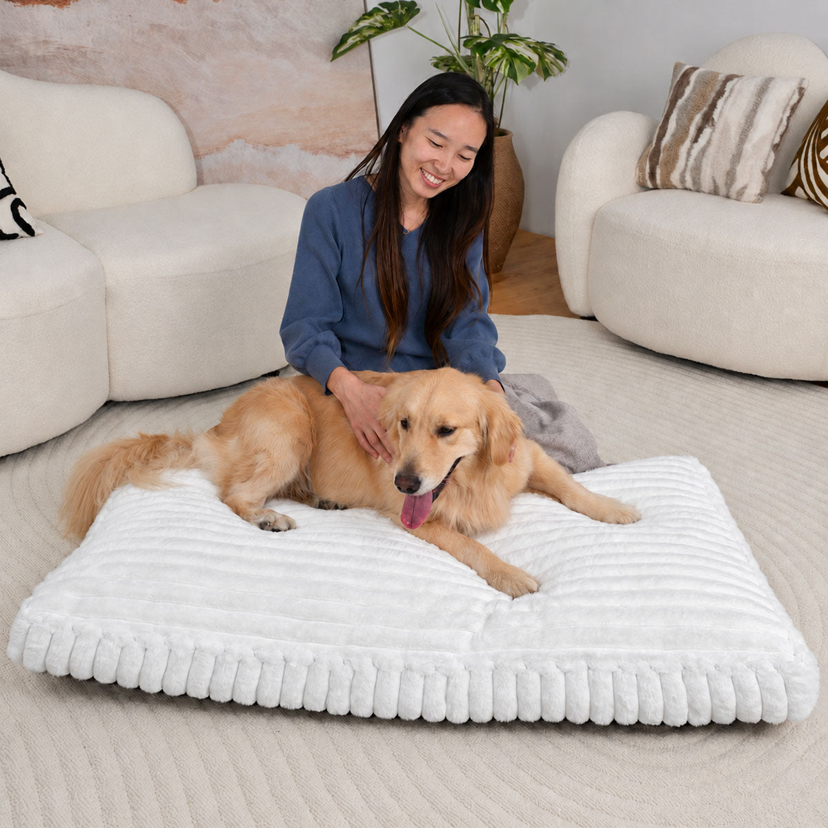White | Furry Corduroy Sleeping Mat: Woman stroking a golden retriever lying on the White mat