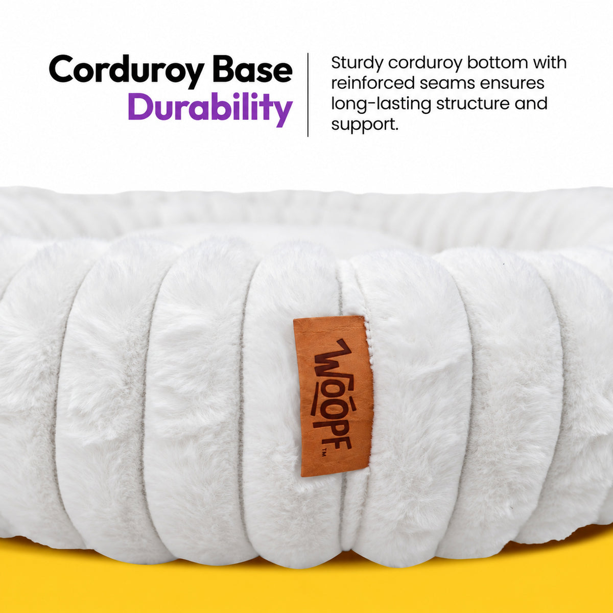 White | Furry Corduroy Round Bed: Close-up of the White bed's corduroy bolster and WOOPF tag