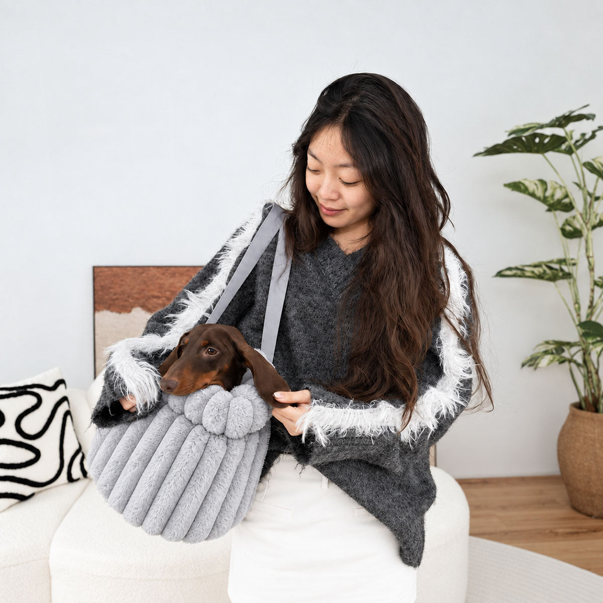 Grey | Corduroy Calming Dog Carrier: Woman carrying a dachshund in the Grey carrier