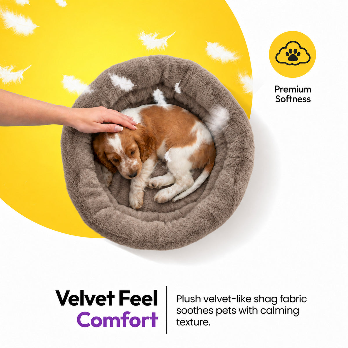 Brown | Furry Range Round Bed: Hand stroking a puppy asleep in the Brown bed, headed Velvet Feel Comfort