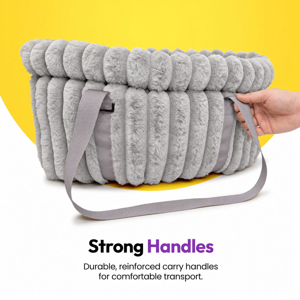 Grey | Corduroy Calming Dog Carrier: Hand lifting the Grey carrier by its handle, headed Strong Handles