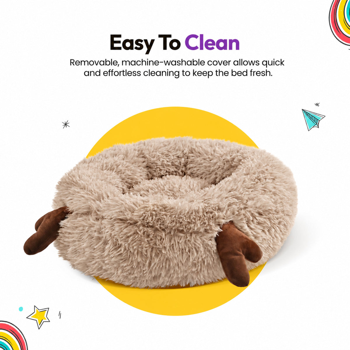 Cream | Fluffy Shag Calming Round Bed with Antlers: The bed on its own, showing its two brown antlers, on a yellow graphic card