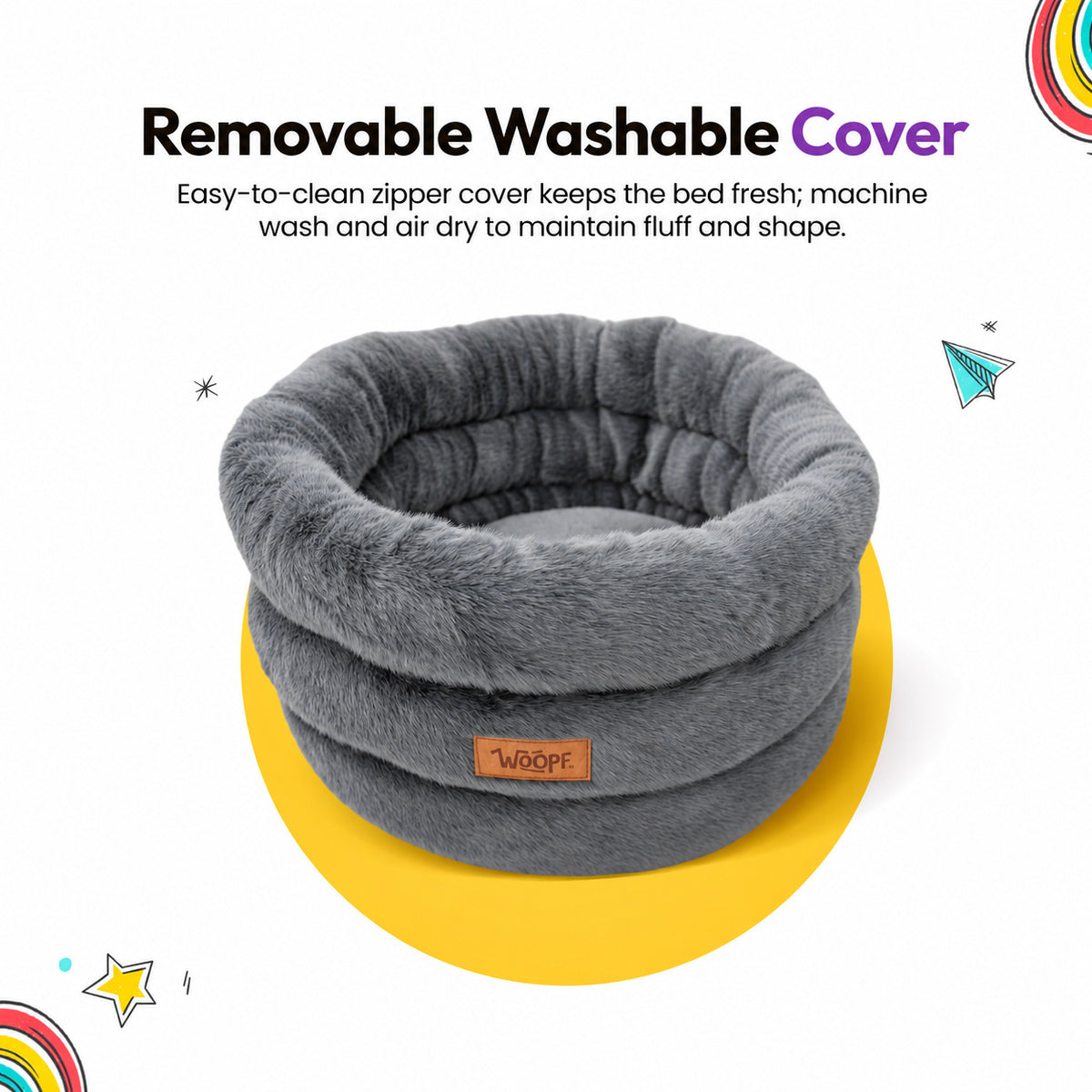 Grey | Furry Range Round Bed: The Grey bed on its own on a yellow graphic card, headed Removable Washable Cover