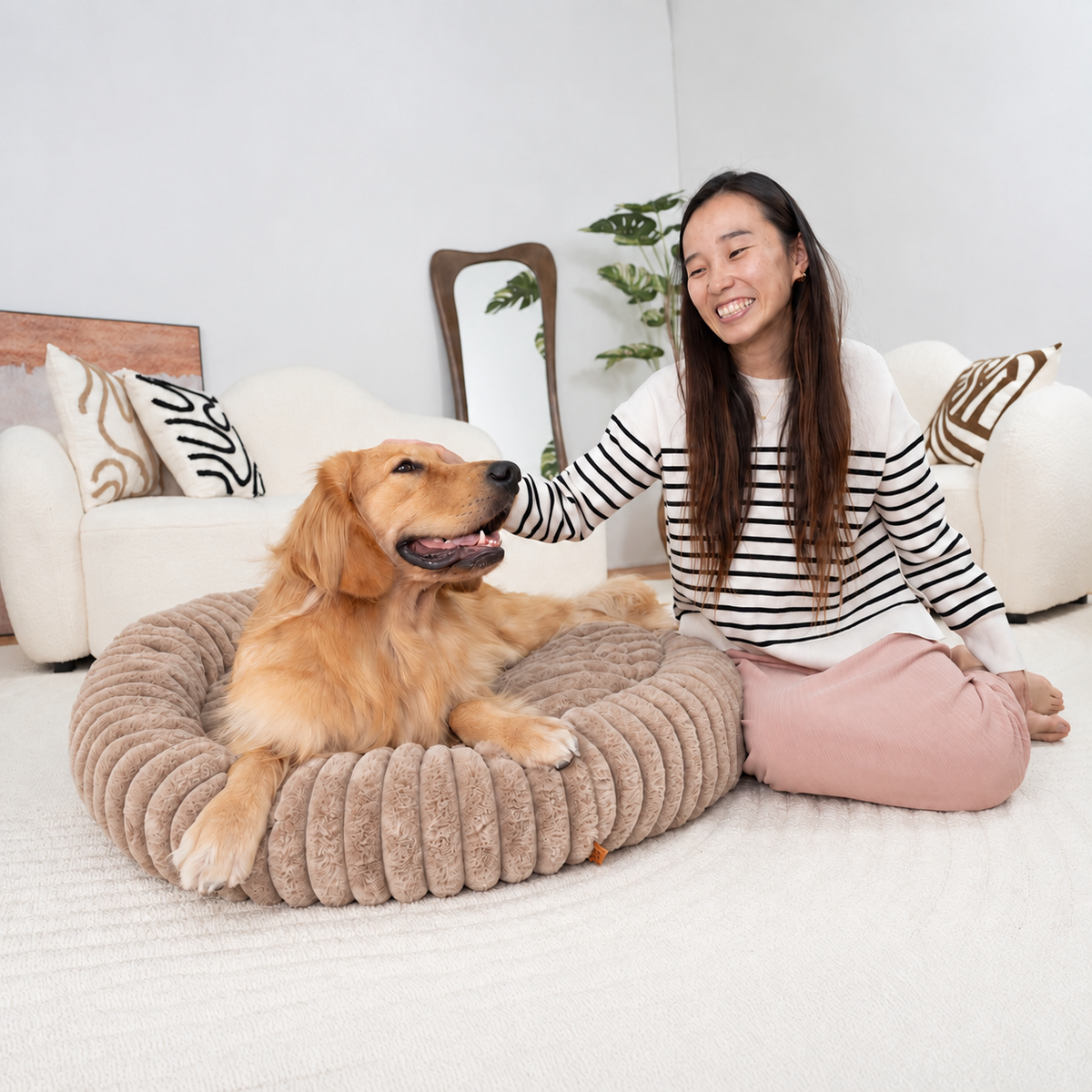 Brown | Furry Corduroy Round Bed: Woman sitting beside a golden retriever lying in the Brown bed