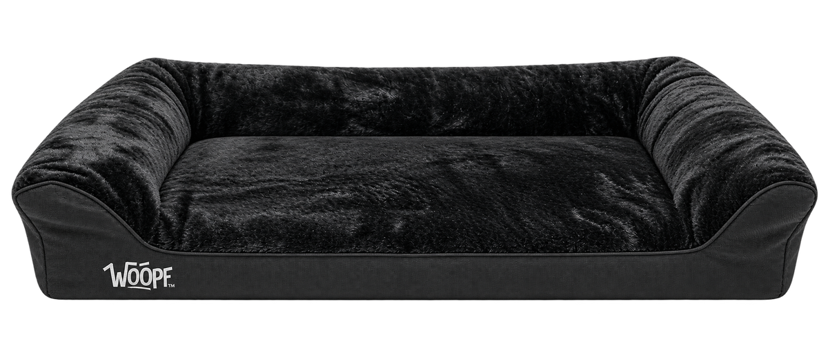 Black | SNÖR Orthopedic Bed: Render of the Large Black bed with plush lining, three-sided bolsters and a low front entry