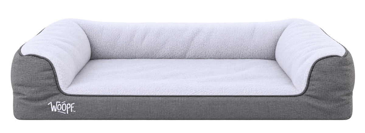 Grey | SNÖR Orthopedic Bed: Render of the Large Grey bed with white plush lining, three-sided bolsters and a low front entry