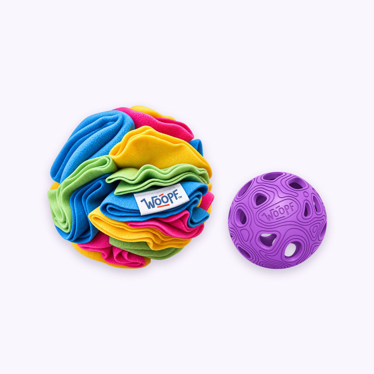 Chase & Sniff Bundle: The Purple MeteorBite Ball with the Snuffle Ball With Crackles on a pale lavender background
