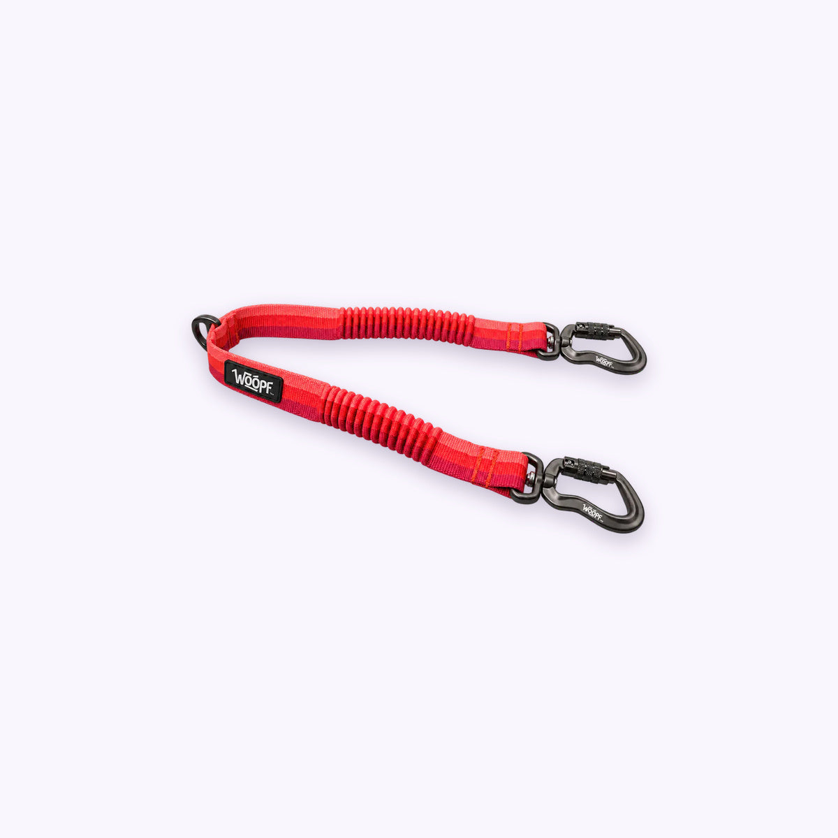 Red | Explorer Two Dog Walker Leash Attachment: The Red coupler on its own on a pale lavender background