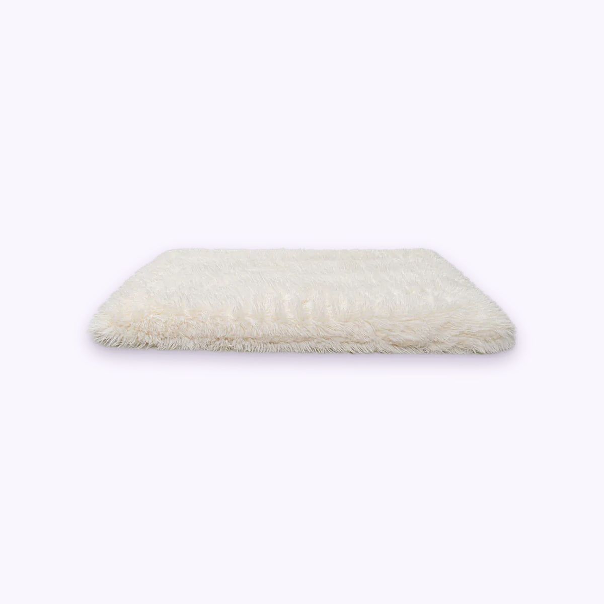 Fluffy Shag Calming Sleeping Mat: The White mat on its own on a pale lavender background