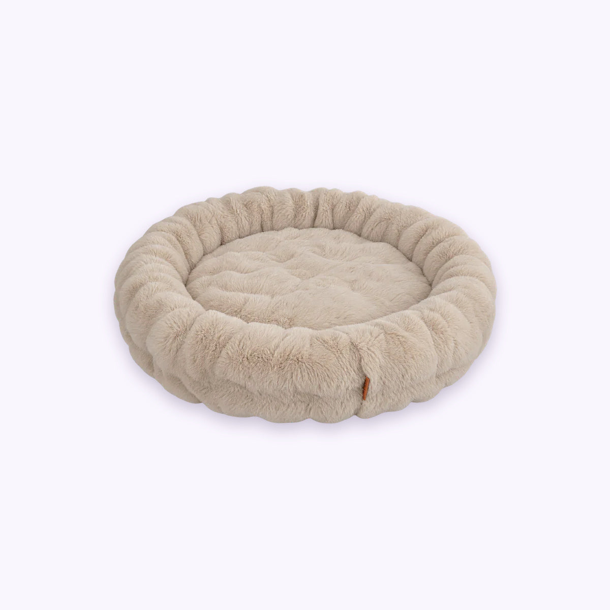 Cream | Furry Curves Round Bed: The Cream bed on its own on a pale lavender background