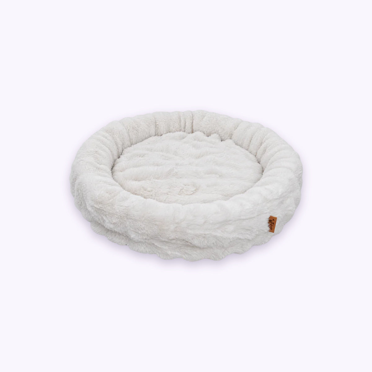 White | Furry Curves Round Bed: The White bed on its own on a pale lavender background