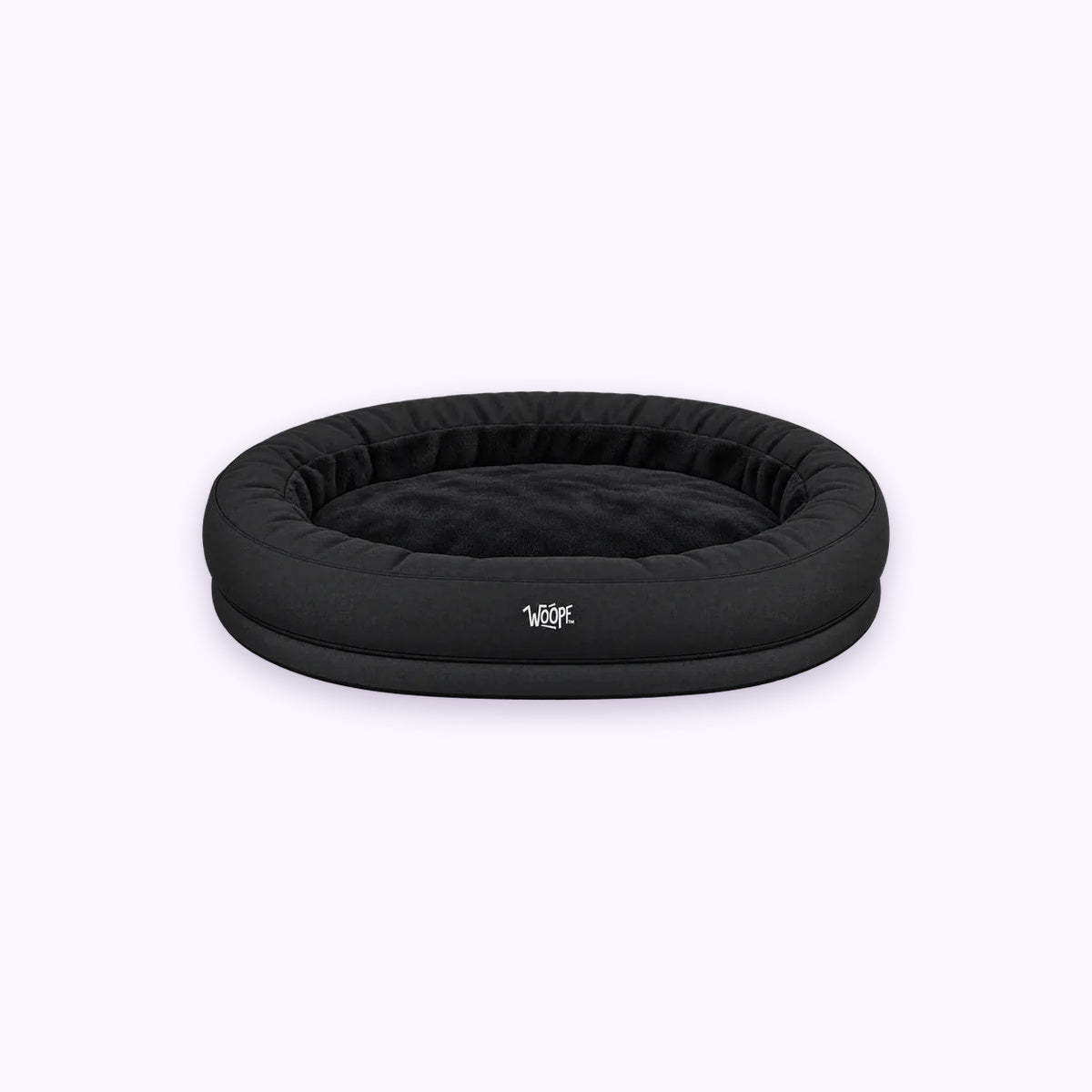 NÄP Orthopedic Bed: The Black bed on its own on a pale lavender background