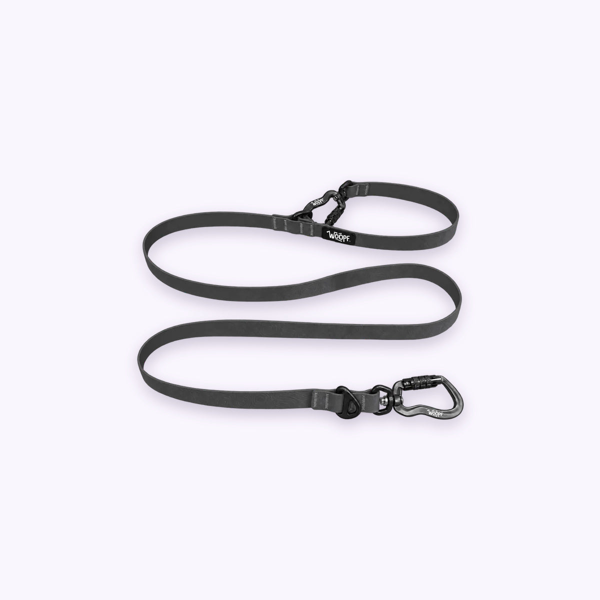 Sealskin Extendable Leash: The Grey lead on its own on a pale lavender background, with both clips and both rings