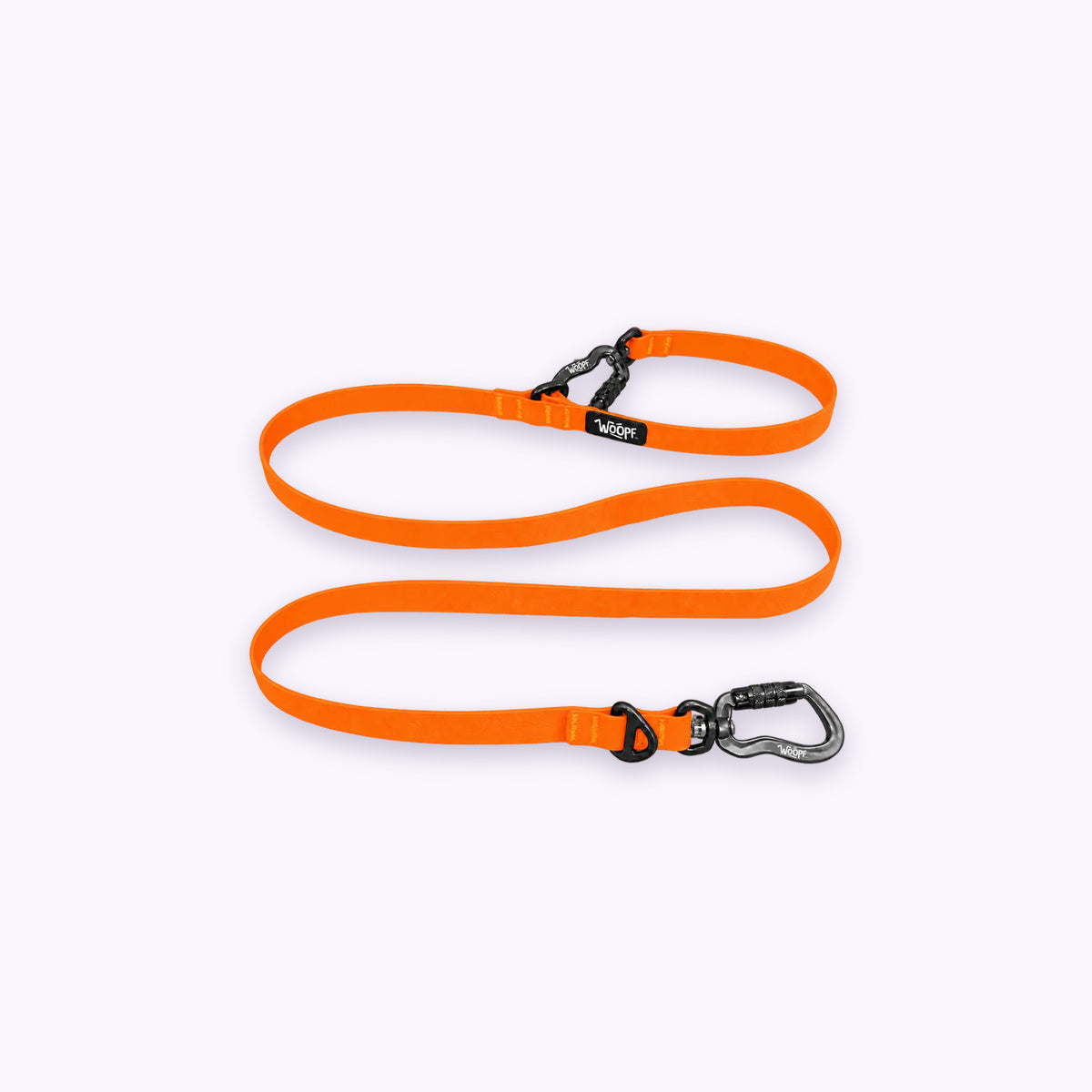 Orange | Sealskin Extendable Leash: The Orange lead on its own on a pale lavender background, with both clips and both rings