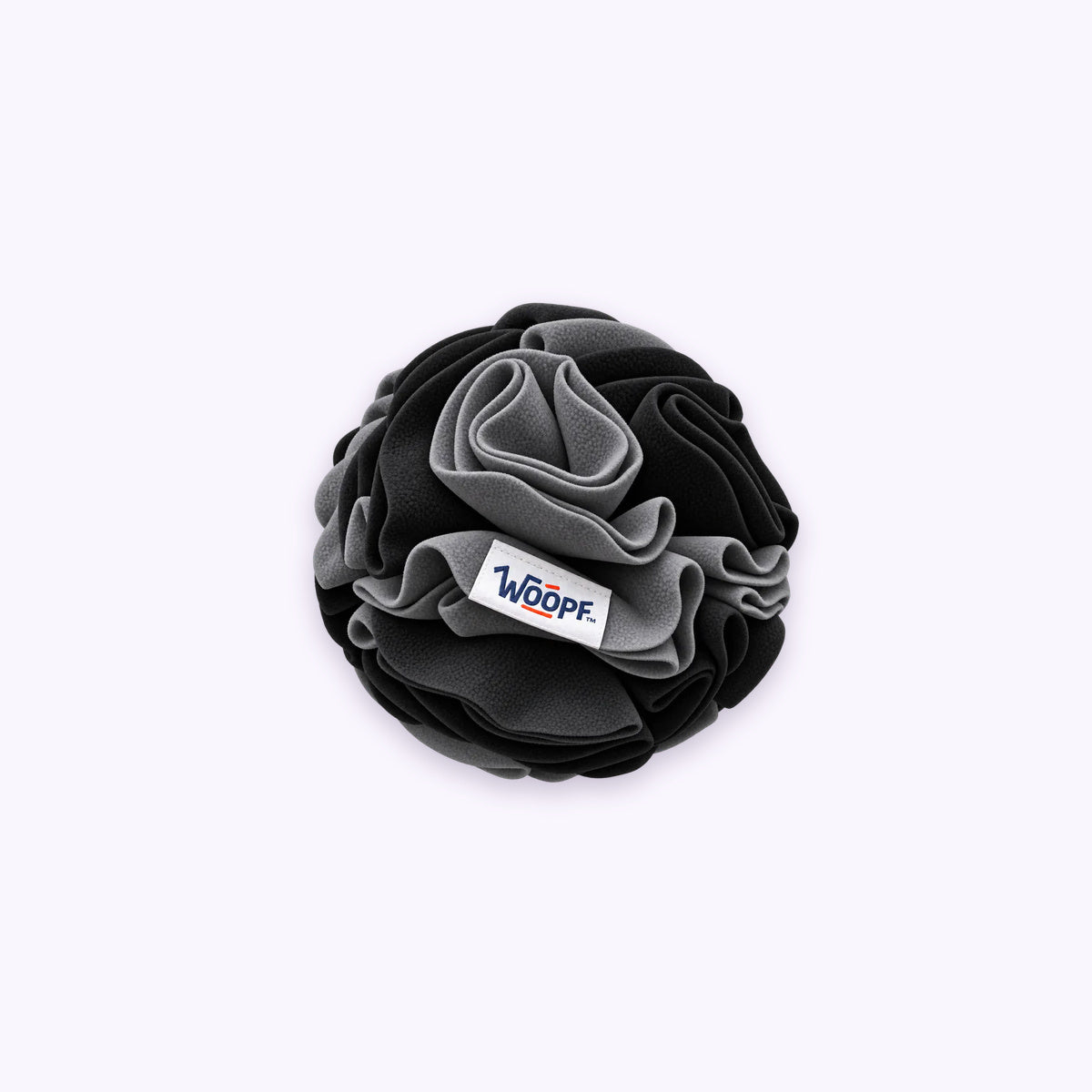 Snuffle Ball: The Black ball on its own on a pale lavender background