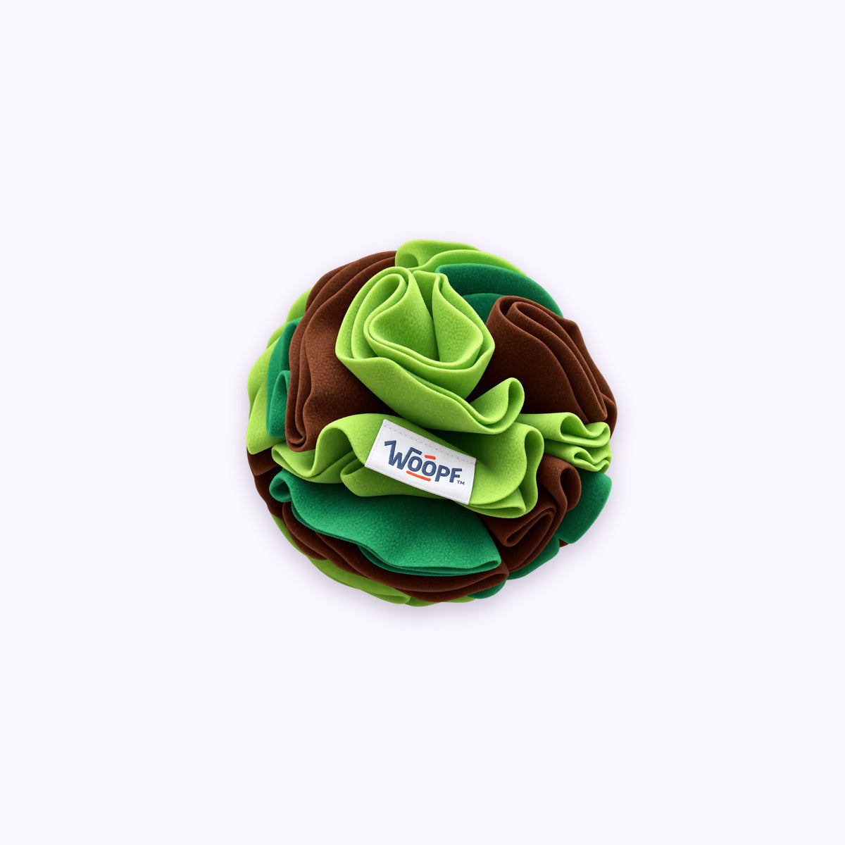Green | Snuffle Ball: The Green ball on its own on a pale lavender background