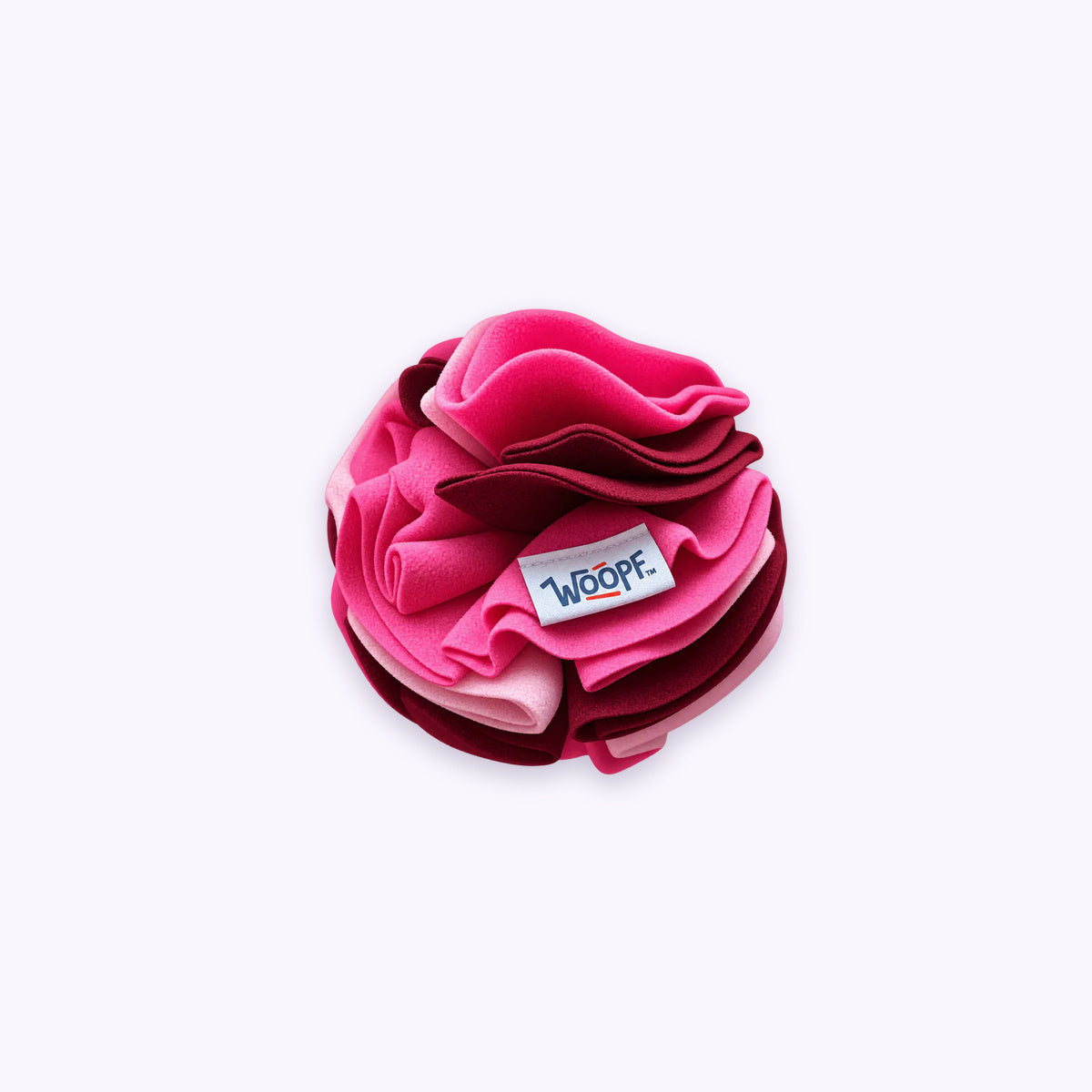Pink | Snuffle Ball: The Pink ball on its own on a pale lavender background