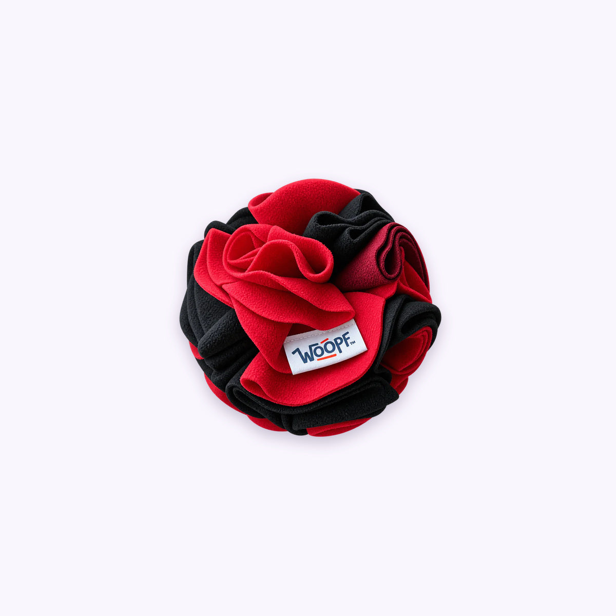 Red | Snuffle Ball: The Red ball on its own on a pale lavender background