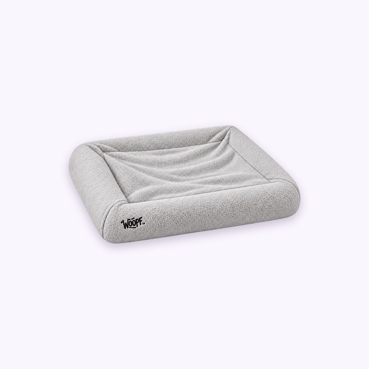 Grey | SNÜZ Bed Slip-On Cover Fleece: The Grey cover on the bed on its own on a pale lavender background