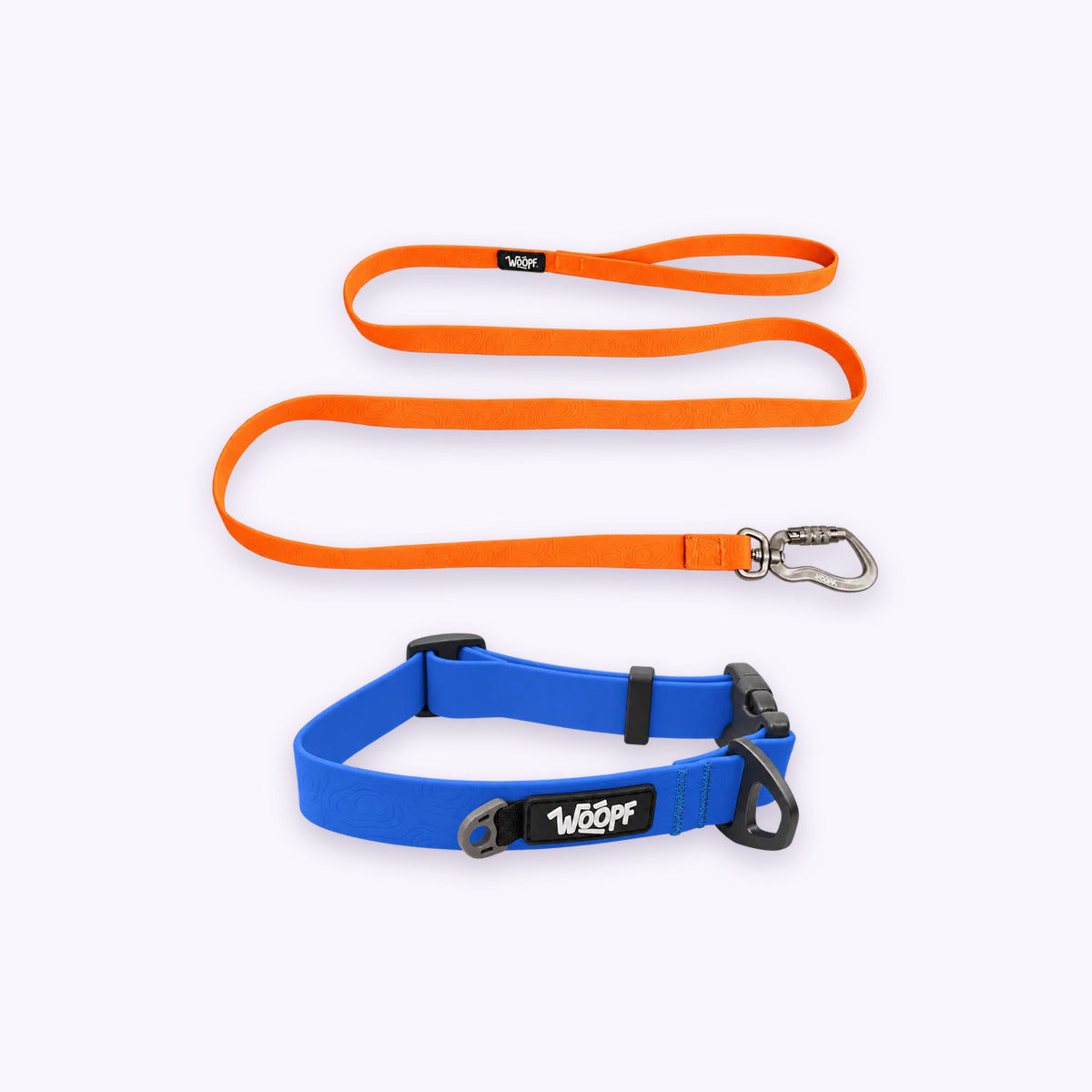 Blue | Swimmer Bundle: The Blue Sealskin Waterproof Dog Collar with the Orange Sealskin Lightweight Waterproof Leash on a pale lavender background