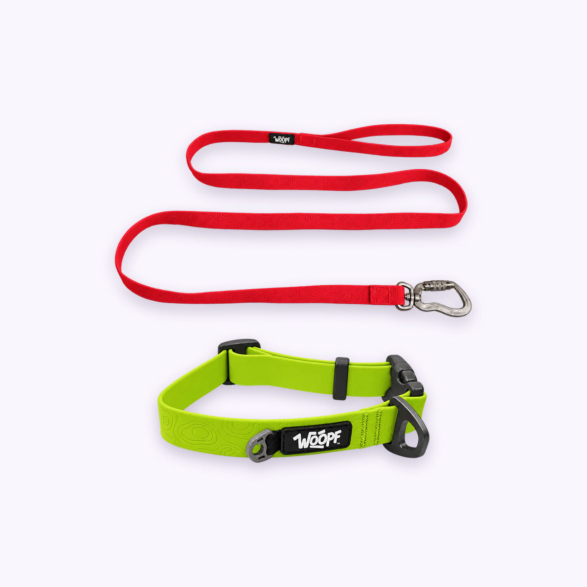 Green | Swimmer Bundle: The Green Sealskin Waterproof Dog Collar with the Red Sealskin Lightweight Waterproof Leash on a pale lavender background