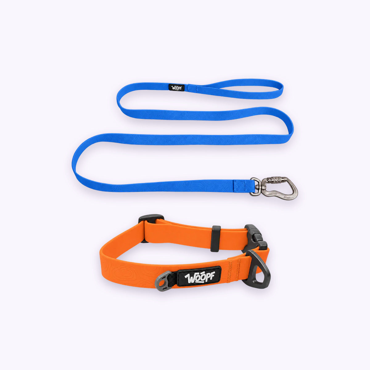 Orange | Swimmer Bundle: The Orange Sealskin Waterproof Dog Collar with the Blue Sealskin Lightweight Waterproof Leash on a pale lavender background