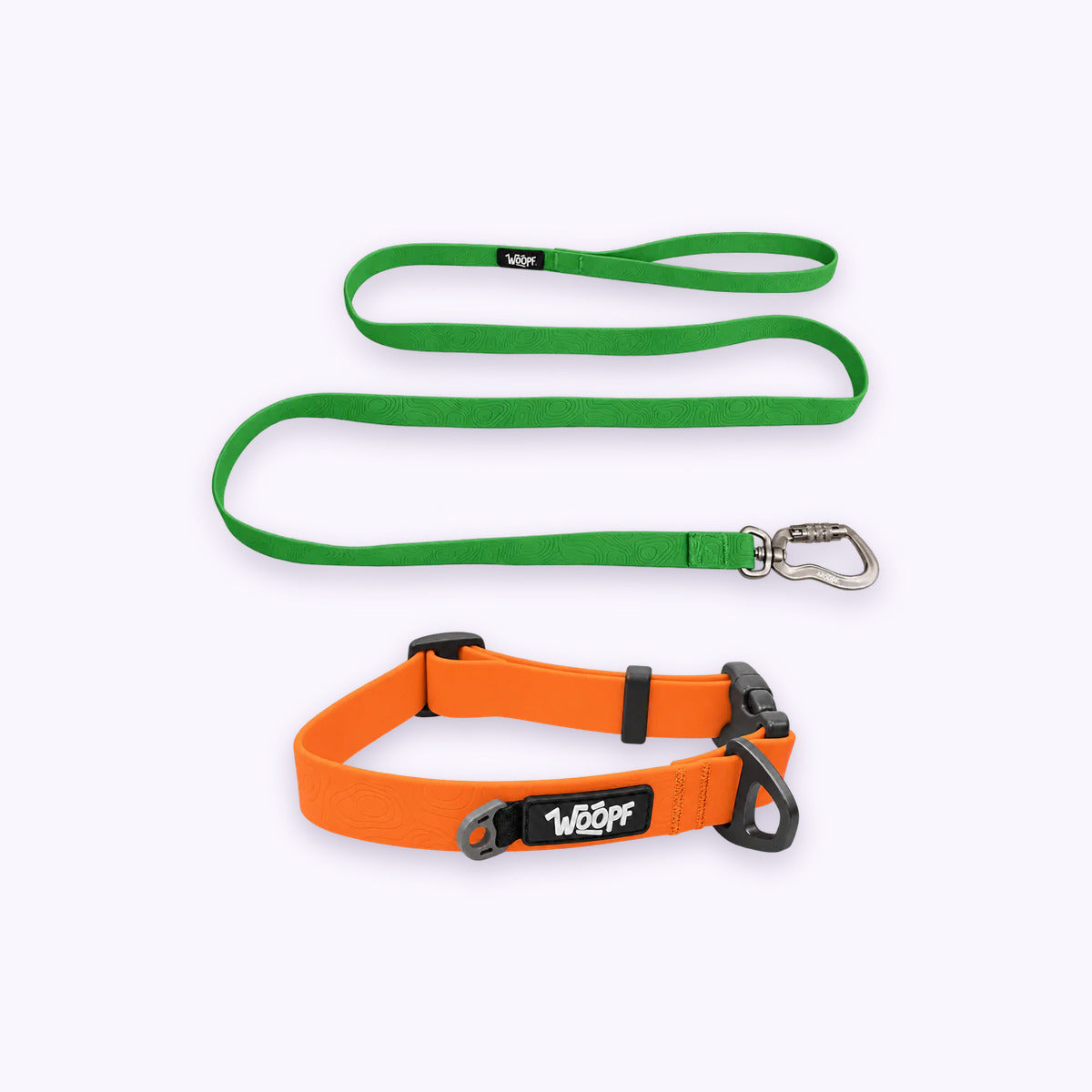 Orange | Swimmer Bundle: The Orange Sealskin Waterproof Dog Collar with the Green Sealskin Lightweight Waterproof Leash on a pale lavender background