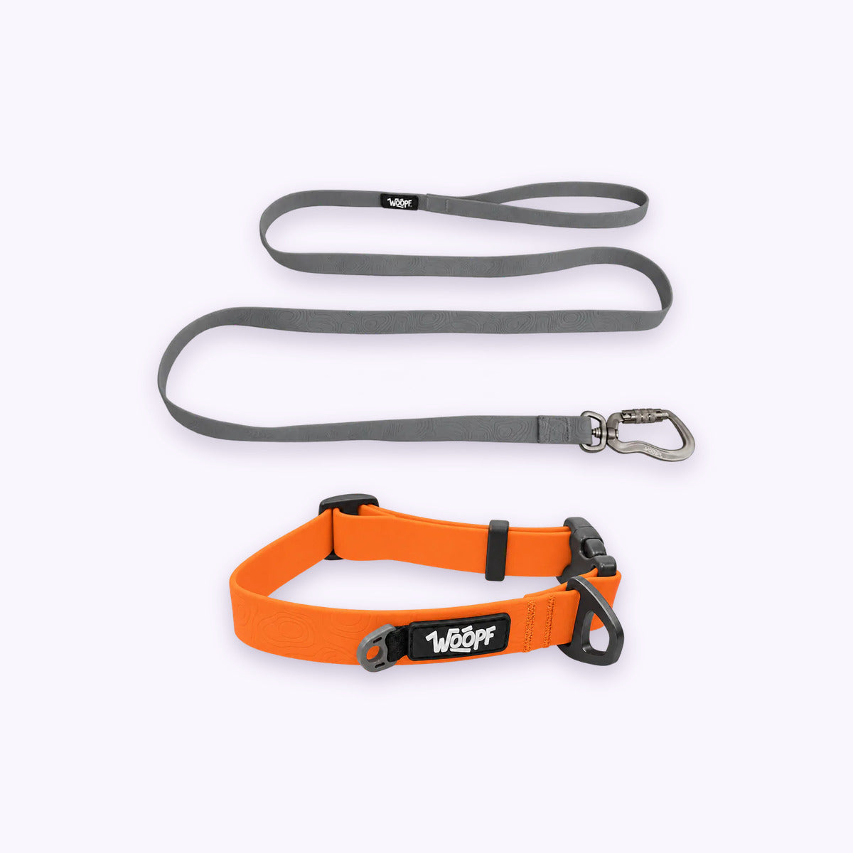 Orange | Swimmer Bundle: The Orange Sealskin Waterproof Dog Collar with the Grey Sealskin Lightweight Waterproof Leash on a pale lavender background