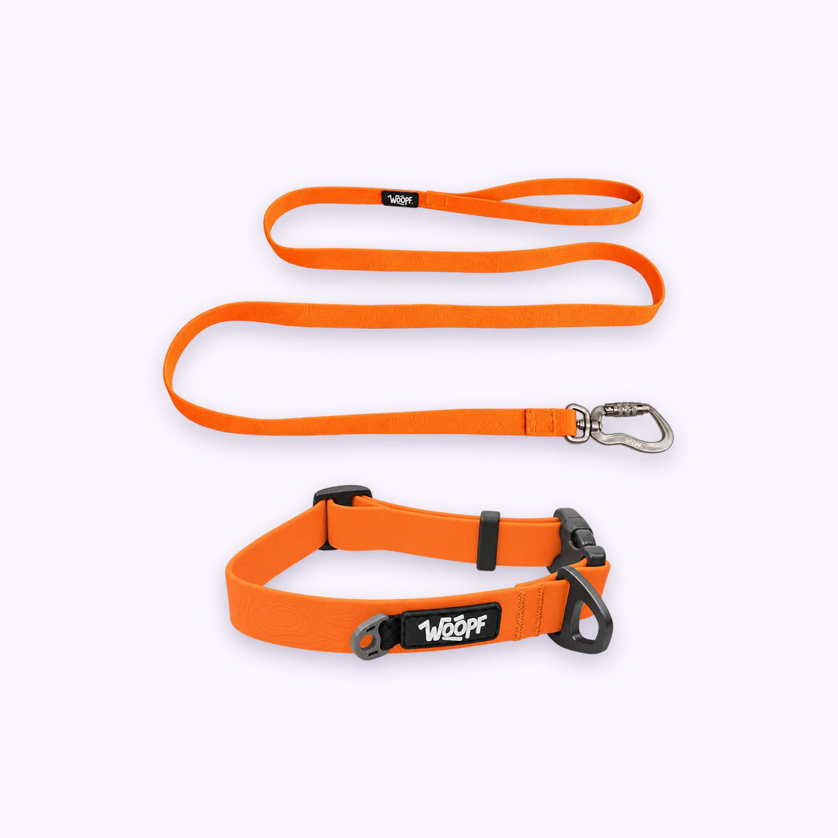 Orange | Swimmer Bundle: The Orange Sealskin Waterproof Dog Collar with the Orange Sealskin Lightweight Waterproof Leash on a pale lavender background