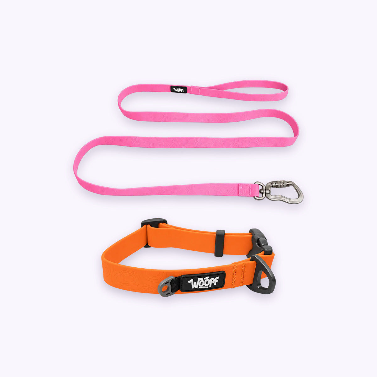Orange | Swimmer Bundle: The Orange Sealskin Waterproof Dog Collar with the Pink Sealskin Lightweight Waterproof Leash on a pale lavender background