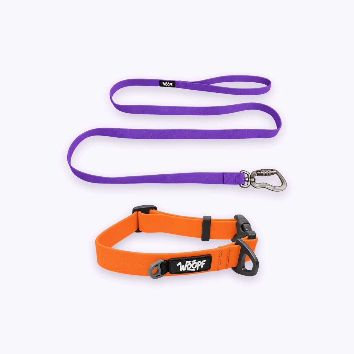 Orange | Swimmer Bundle: The Orange Sealskin Waterproof Dog Collar with the Purple Sealskin Lightweight Waterproof Leash on a pale lavender background