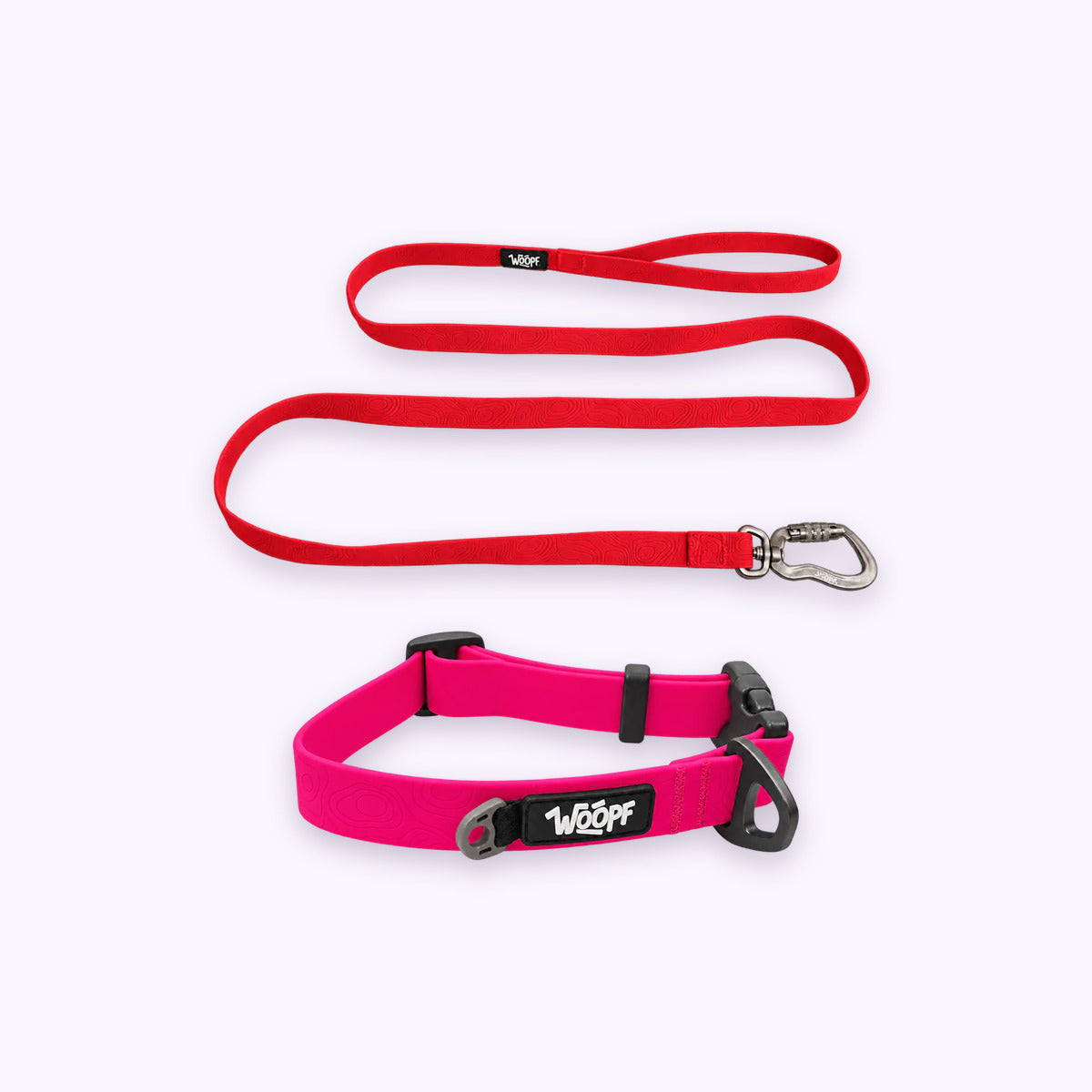 Pink | Swimmer Bundle: The Pink Sealskin Waterproof Dog Collar with the Red Sealskin Lightweight Waterproof Leash on a pale lavender background