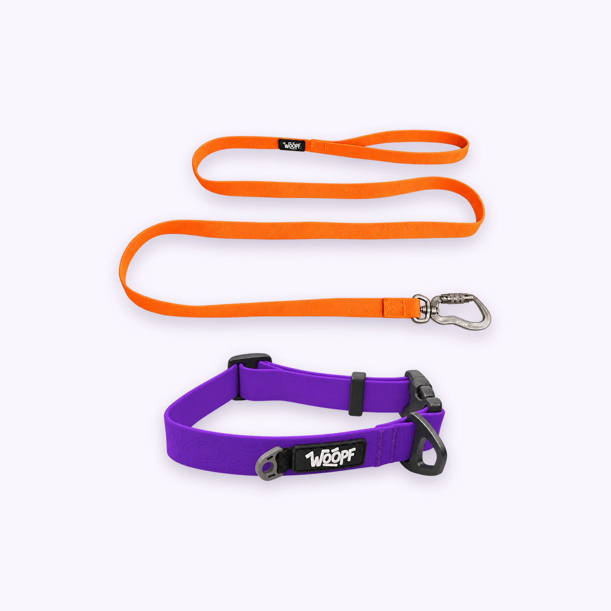 Purple | Swimmer Bundle: The Purple Sealskin Waterproof Dog Collar with the Orange Sealskin Lightweight Waterproof Leash on a pale lavender background