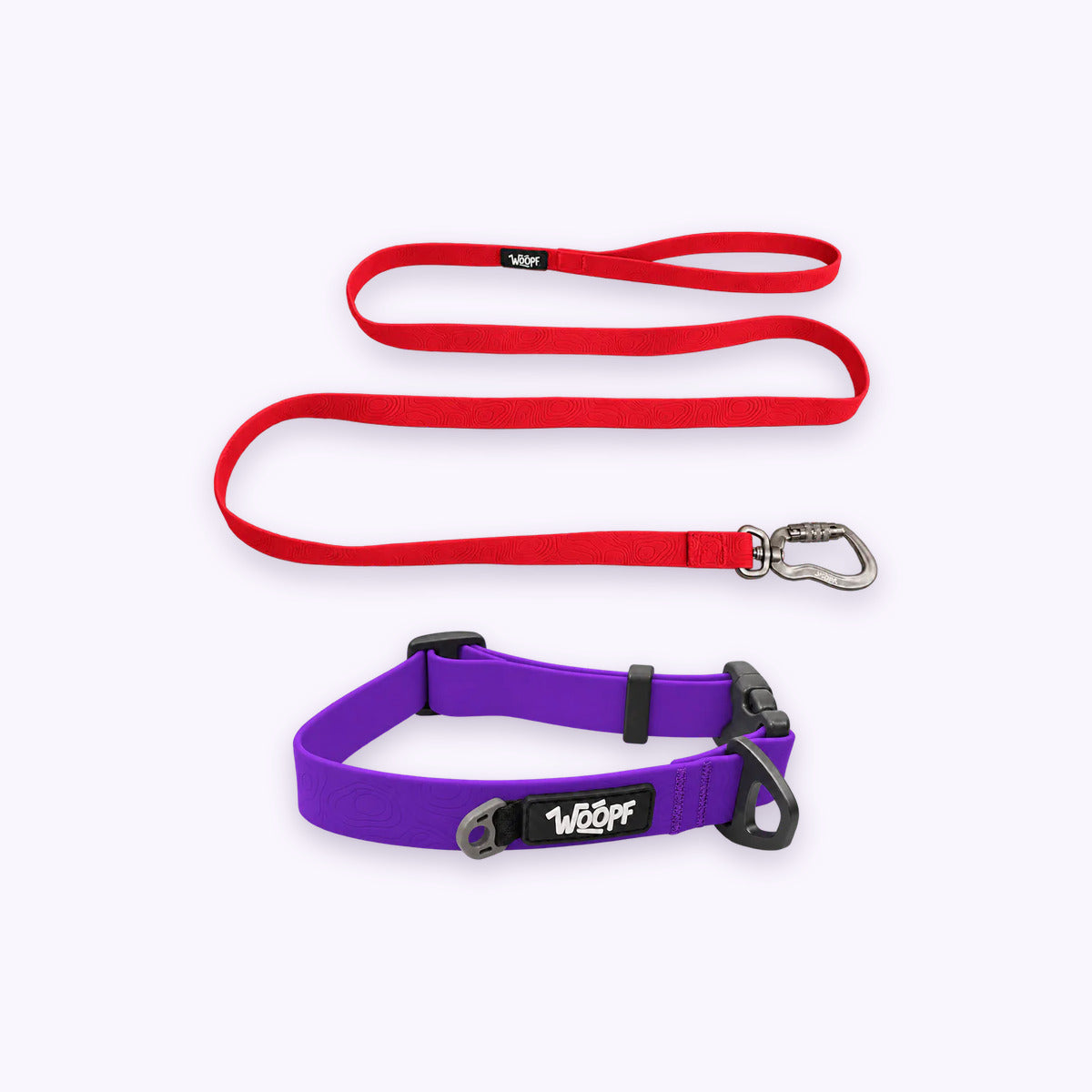 Purple | Swimmer Bundle: The Purple Sealskin Waterproof Dog Collar with the Red Sealskin Lightweight Waterproof Leash on a pale lavender background