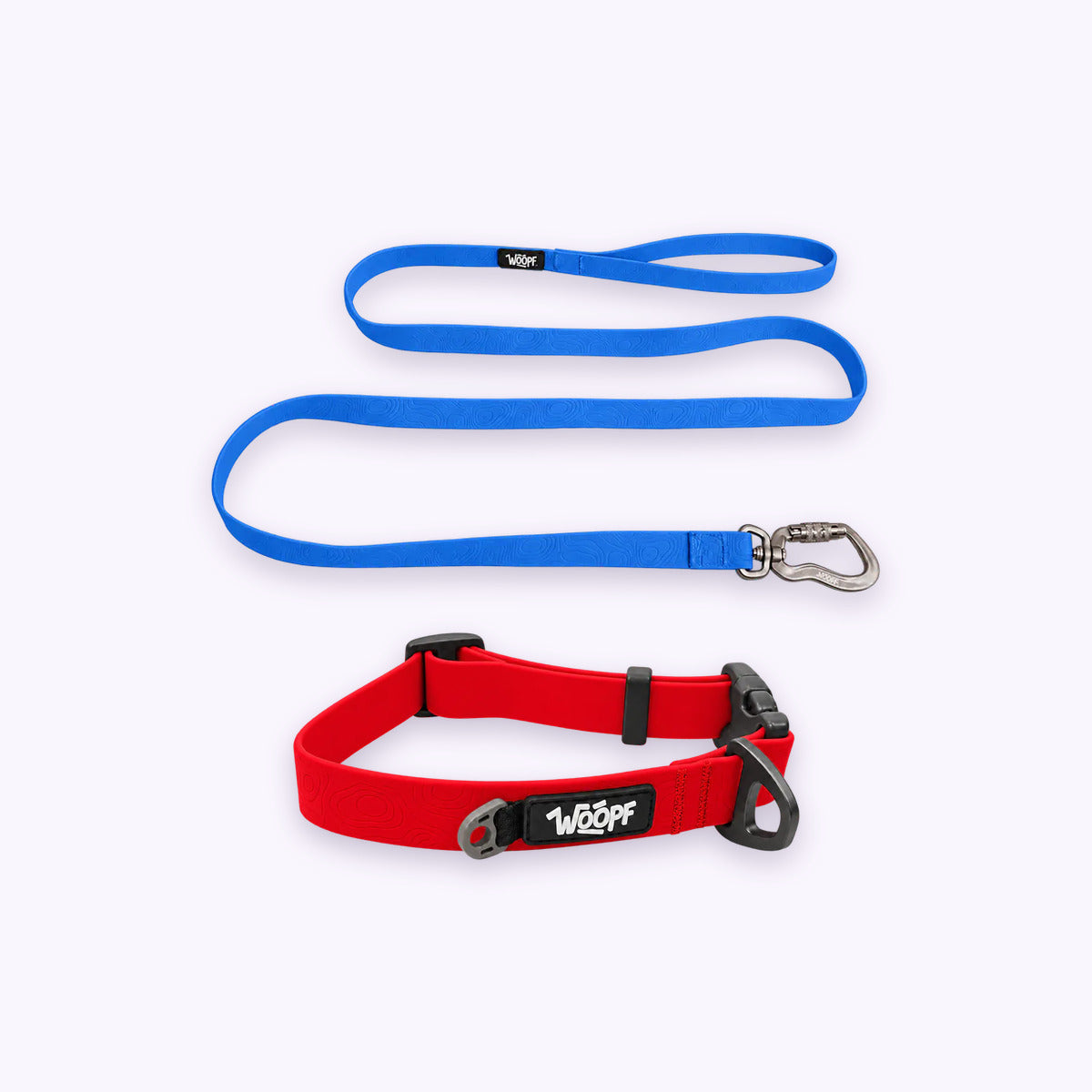 Red | Swimmer Bundle: The Red Sealskin Waterproof Dog Collar with the Blue Sealskin Lightweight Waterproof Leash on a pale lavender background