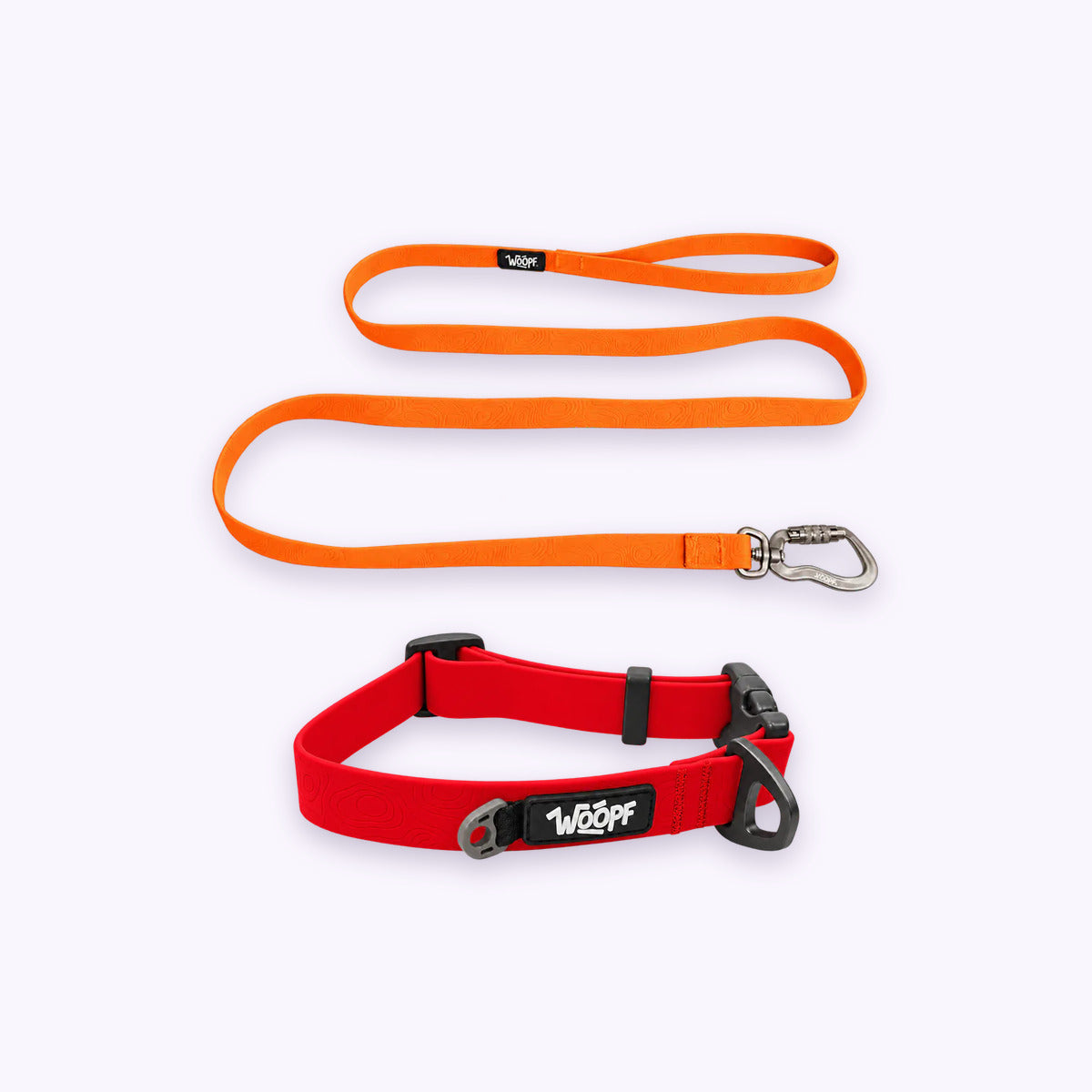 Red | Swimmer Bundle: The Red Sealskin Waterproof Dog Collar with the Orange Sealskin Lightweight Waterproof Leash on a pale lavender background