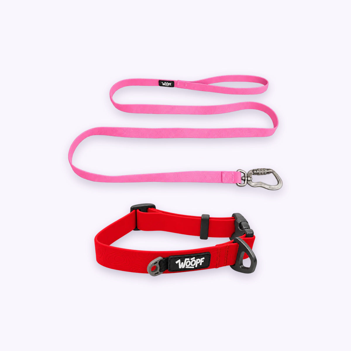 Red | Swimmer Bundle: The Red Sealskin Waterproof Dog Collar with the Pink Sealskin Lightweight Waterproof Leash on a pale lavender background