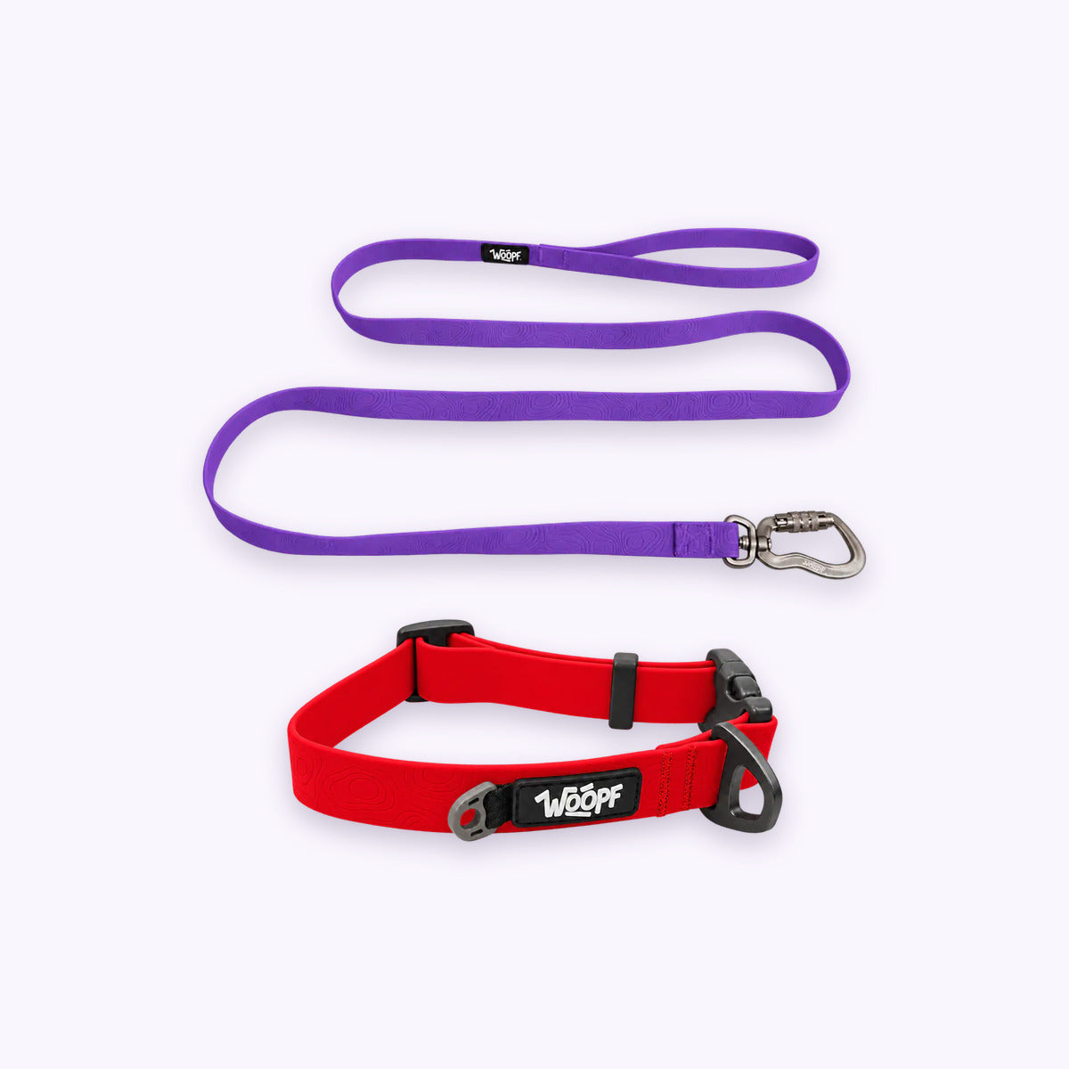 Red | Swimmer Bundle: The Red Sealskin Waterproof Dog Collar with the Purple Sealskin Lightweight Waterproof Leash on a pale lavender background