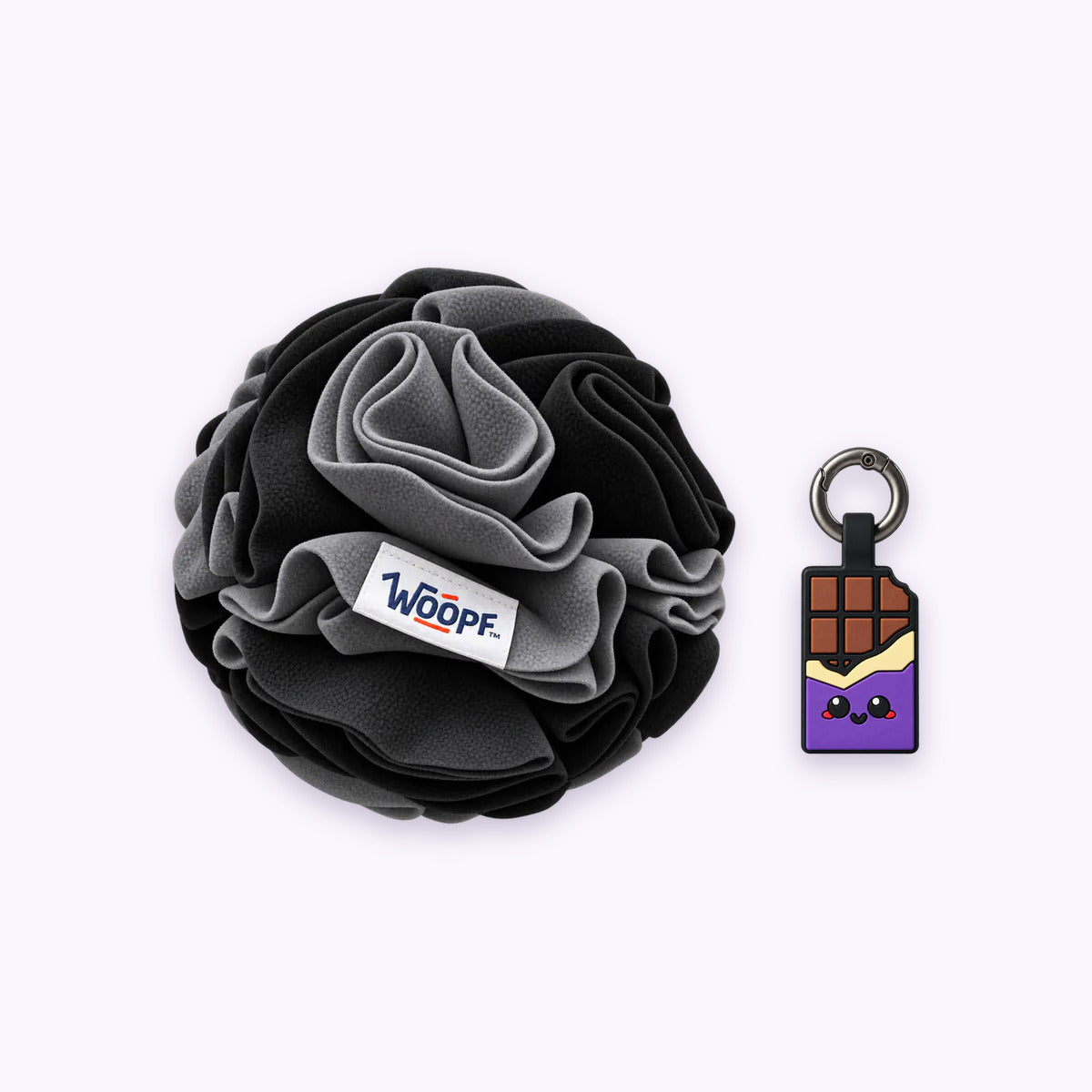Black | Tag & Sniff Bundle: The Black Snuffle Ball with the Chocolate Purple Smart ID Tag on a pale lavender background