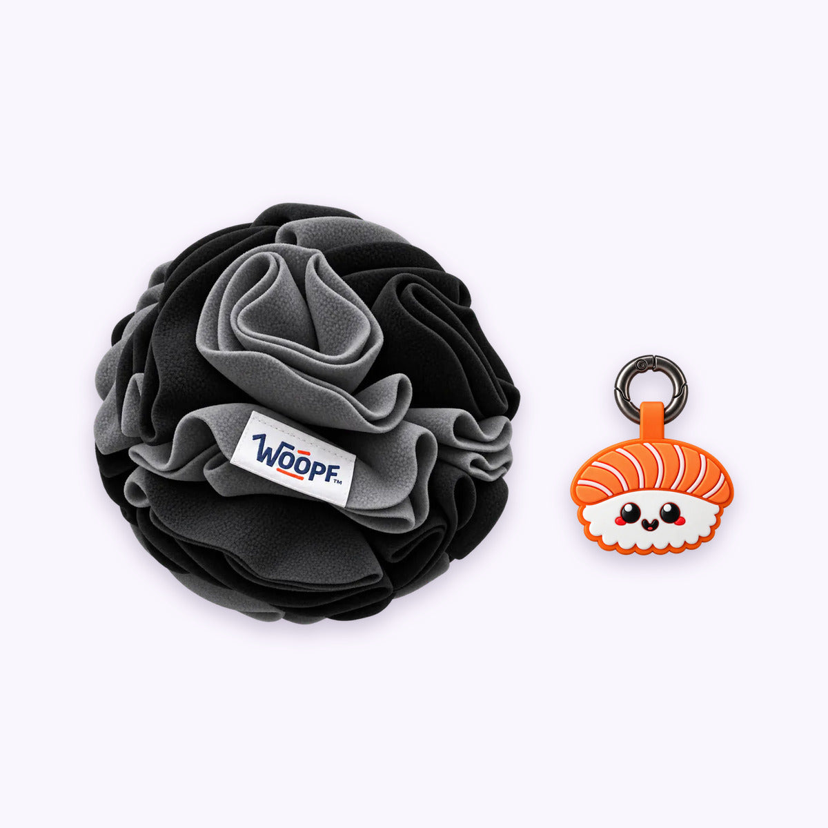 Black | Tag & Sniff Bundle: The Black Snuffle Ball with the Salmon Sushi Smart ID Tag on a pale lavender background