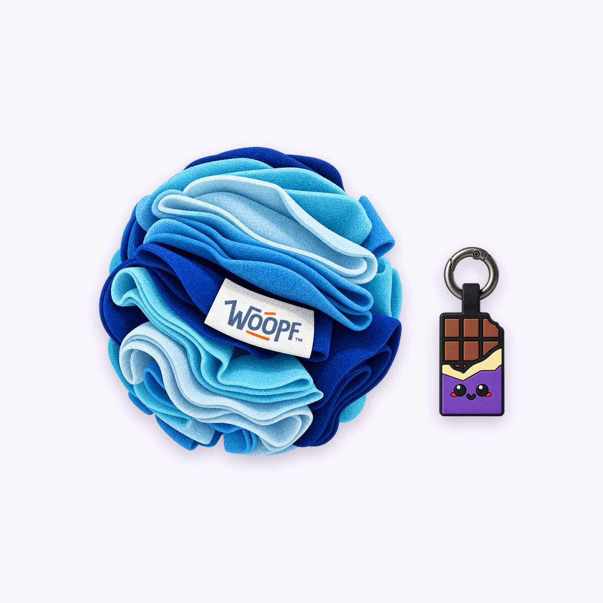 Blue | Tag & Sniff Bundle: The Blue Snuffle Ball with the Chocolate Purple Smart ID Tag on a pale lavender background