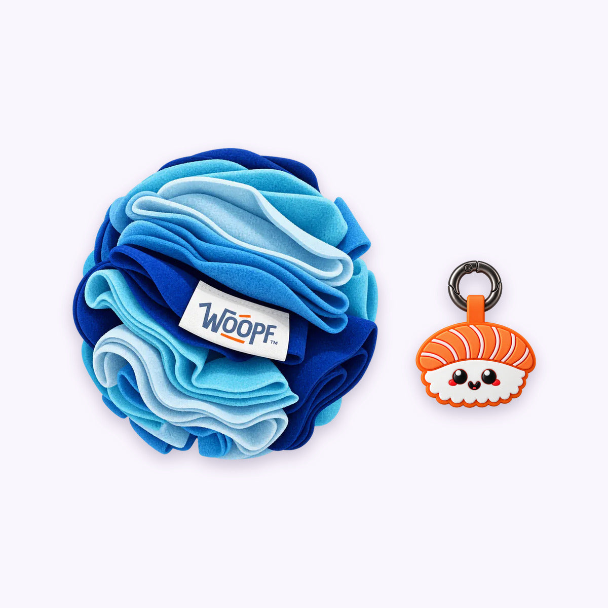 Blue | Tag & Sniff Bundle: The Blue Snuffle Ball with the Salmon Sushi Smart ID Tag on a pale lavender background