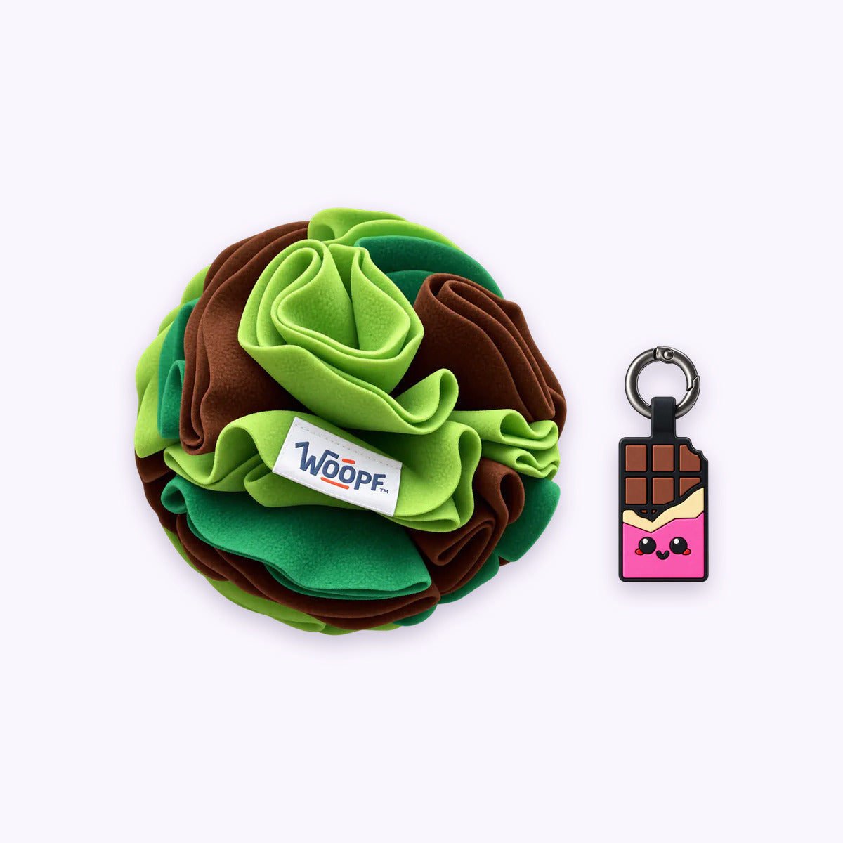 Green | Tag & Sniff Bundle: The Green Snuffle Ball with the Chocolate Pink Smart ID Tag on a pale lavender background