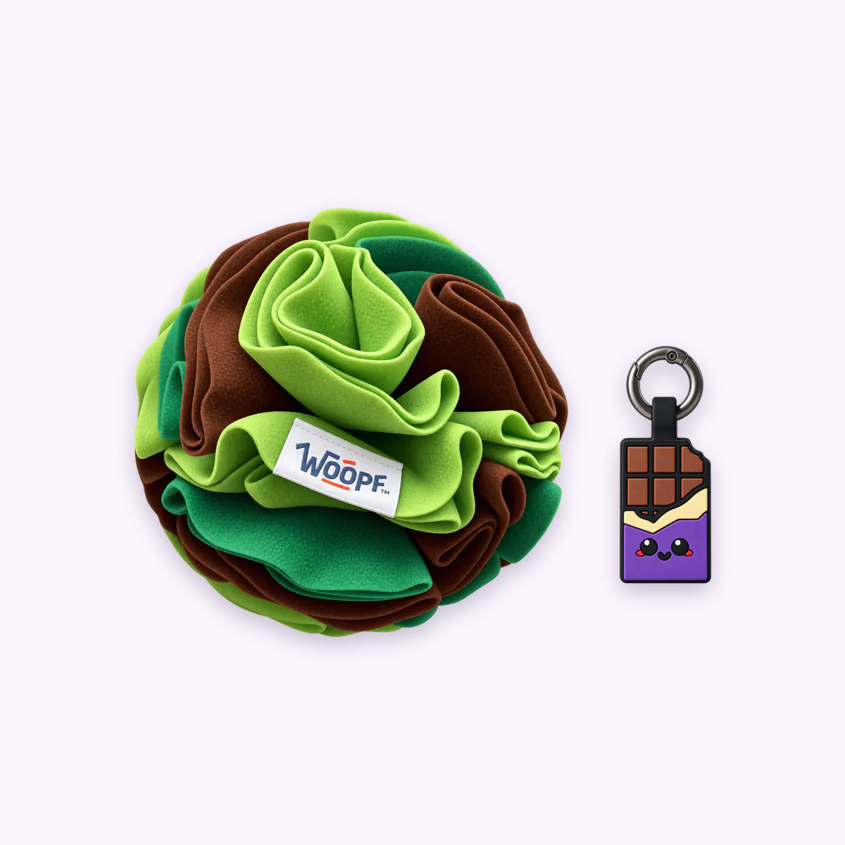 Green | Tag & Sniff Bundle: The Green Snuffle Ball with the Chocolate Purple Smart ID Tag on a pale lavender background